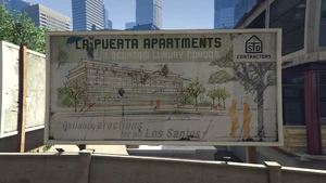 Sign announcing La Puerta Apartments.