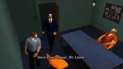 A police officer lets Toni in.