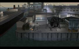 As the men arrive at the meeting spot in the docks, they see a black helicopter approaching.