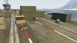 AssaultonATT16-GTAOe-AttackerLoadoutCrates4.png (3.69 MB) Attacker loadout crates on the south side of the carrier. The same crates are also used during the final stage of the assault.