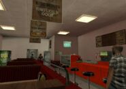 Interior of the normally inaccessible Jim's Sticky Ring interior in GTA San Andreas, complete with Rusty Brown's signage hung from the ceiling.