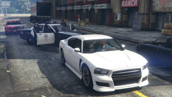 Jernigan and another female officer attempting to arrest Franklin after he meets with Barry.