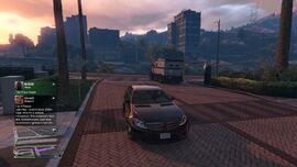 A white/black Stockade leaving The Diamond Casino & Resort in Grand Theft Auto Online.