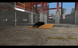 Tommy arrives at the construction site in Vice Point to see the black limo drive down the ramp.