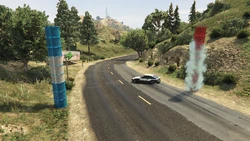 Continuing downhill, past some blue pillars