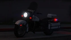 A Police Bike with lights and sirens activated