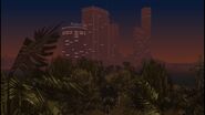 Downtown Vice City at night, seen from Leaf Links in Grand Theft Auto: Vice City Stories.