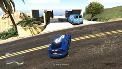  parked at the entrance of the neighboring mansion