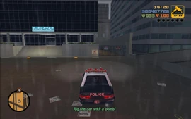 Claude is tasked with planting a bomb in the car.