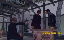 Kenji signals for the bodyguard to not touch Claude and leave them alone for a few moments.