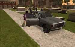 Kane arriving at the funeral.