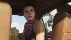 Lucia holding a stack of  in the passenger seat of a 