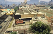 CypressFlats-GTAO-VehicleWarehouseExterior.png