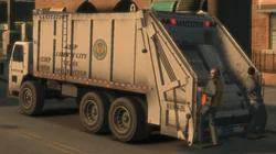  workers hanging from the rear of a Trashmaster in 