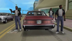 His hired gunmen carrying Tec-9s.