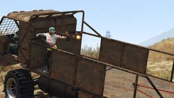 A player firing from the rear of the vehicle; a drive-by position unique to the Wastelander