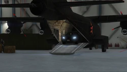 Gunmen drive out of the cargo bay of the 