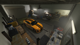 Garage area, with Raf's Cinquemila parked inside.