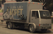 An Easy Lay Carpet Store Mule with graffiti in GTA IV.