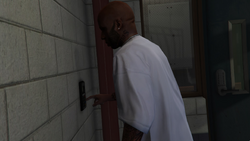 Unlocking the rear exit using a code he has memorized.