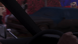 A partially covered Emperor parked in La Perle in the second trailer.