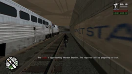 The train arrives at Market Station. The reporter prepares to exit.