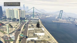 Stash the helicopter at the marked rooftop location near the Garment Factory.