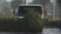 An Isuzu Elf-inspired truck with flatbed configuration