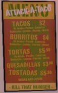 The food options posted on the menu on the side of the Taco Van.