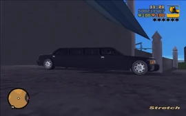 Claude driving the unique black limo out of the garage.