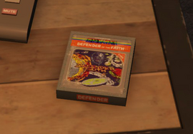 Defender of The Faith cartridge box on the desk in the Arcade Office.