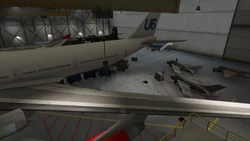 The scene in the hangar