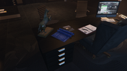 The vault blueprints on Agatha's desk.