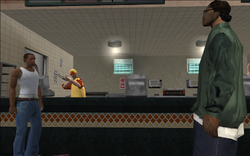 The clerk grabs a shotgun while the two were chatting.