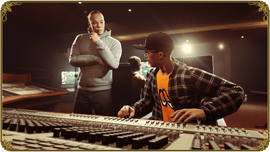 Promotional screenshot of Dr. Dre and DJ Pooh in the studio.