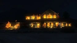 The house burning after being destroyed in 