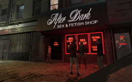 Prostitutes hanging out in front of the After Dark front entrance in Industrial, Bohan at night.