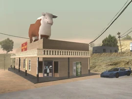 The Smokin' Beef Grill's building, with a Sprunk machine and a Turismo.