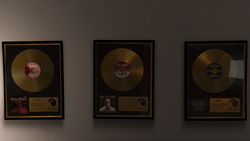 Gold discs on the wall of 3671 Whispymound Drive in Grand Theft Auto V.