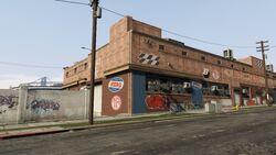 The Auto Fix Factory at the start of the street.