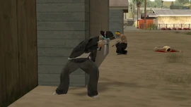 Gal armed with a Tec-9, fighting the Vagos in an alley in El Corona.