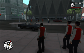 During the wait, several cars stop by the car port and get serviced by other valets.