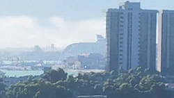The cruise ship distantly seen docked at  in a postcard video of  on the game's 