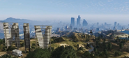 Behind of the Vinewood Sign, with a Buzzard flying into the city.