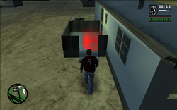 Carl walking into the trailer to drop the camera off.