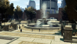 The Castle Gardens park area to the west with its grand fountain and park pavilions in the background, GTA IV.