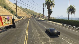 The racers proceed towards the city.