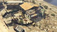 The auto repair garage business at the northern end of Stab City.