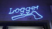 A blue Logger Beer neon sign in Liquor Ace.