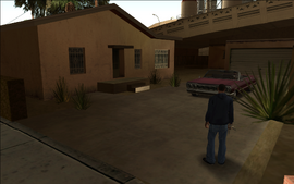 As CJ is waiting by the garage, a mechanic drives out in a Savanna.